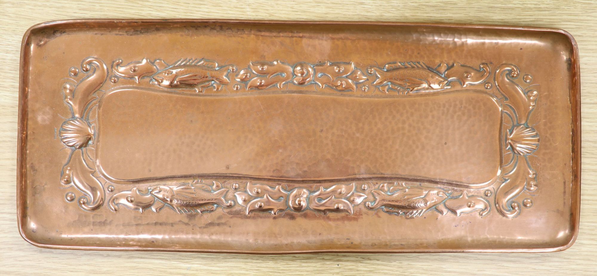 A Newlyn copper tray, stamped mark, 47 x 19.5cm